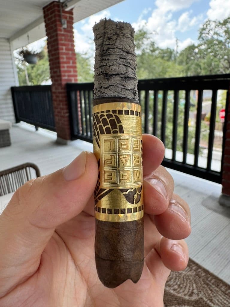 Création Liberté with long ash and V-cut head mid-smoke