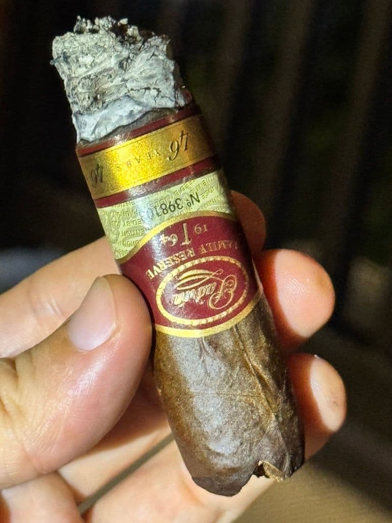 Padrón Family Reserve 46 mid-smoke showing V-cut and ash stack